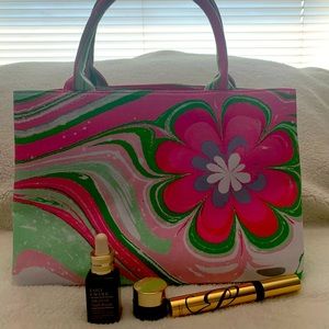 Estée Lauder bag with removable shoulder strap.